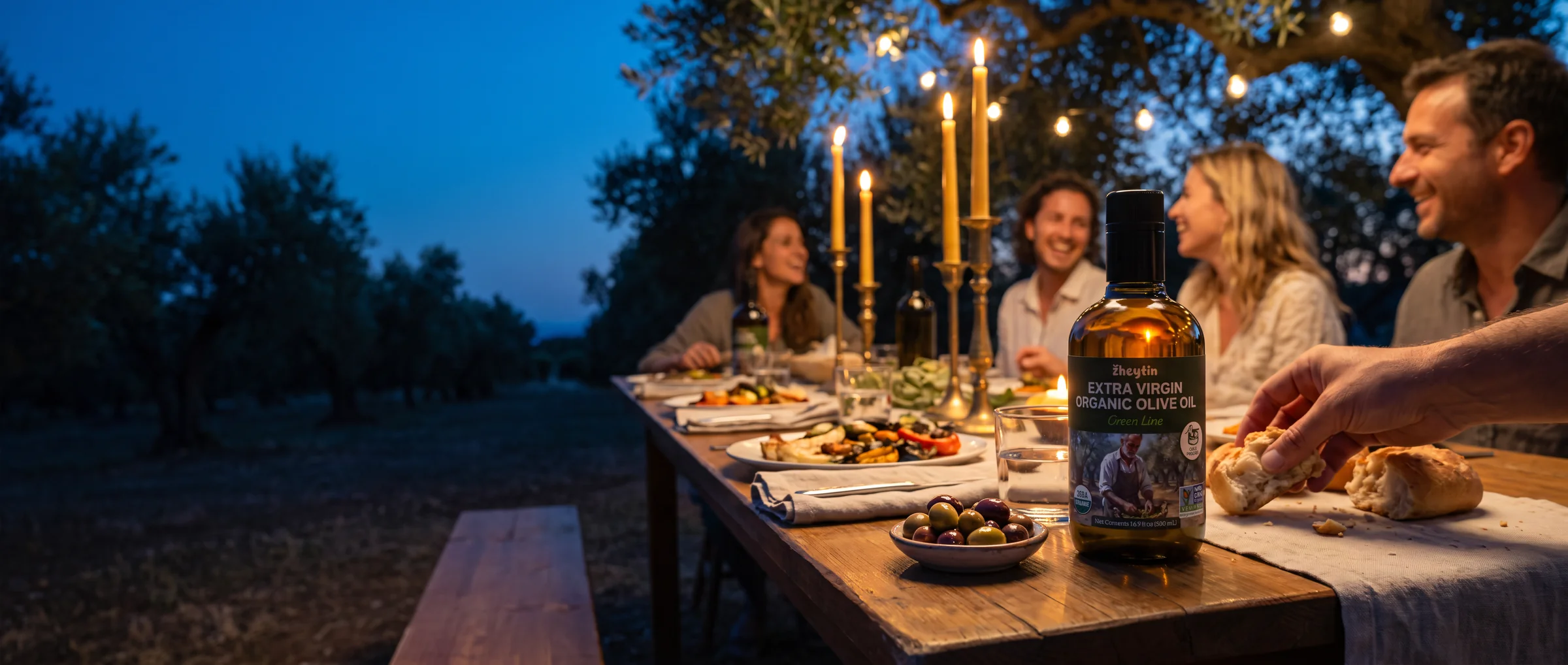 A candlelit dinner under the olive trees at dusk